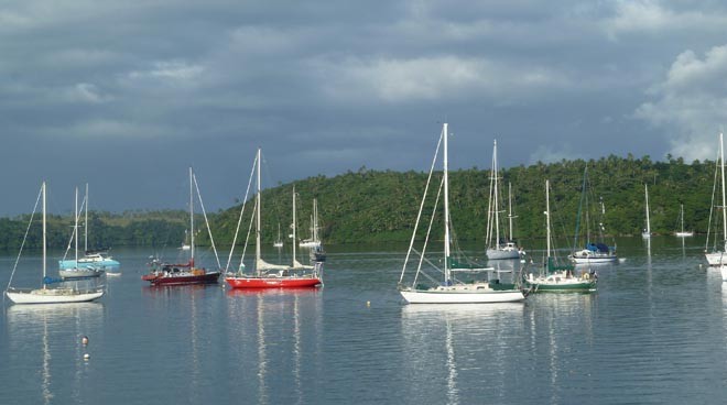 Guppy with other boats anchored in Tonga ©  SW